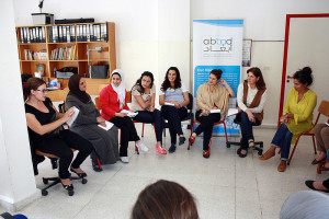 Participants of the Organize Support Groups for Women Victims of GBV training simulating a support group session among Syrian refugee women. Photo by Lina Abirafeh.