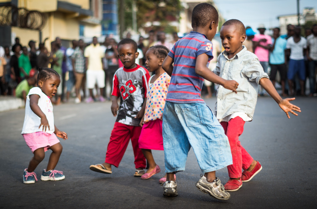 Children dancing to the sounds of rap in Monrovia, Liberia. Photo by Ingrid Gercama. 