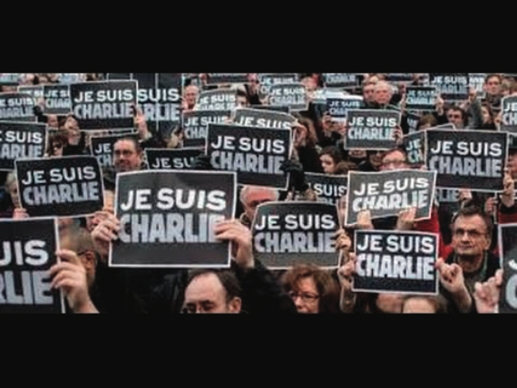 Figure 2. People marching with “Je Suis Charlie” signs during the January 11th “March of the Republic” in Paris. Credit: Gary Cooper, Je Suis Charlie (1), dé lé. Paris Le 11 Janvier 2015. I Am Charlie Parade Paris. (France, 2015).